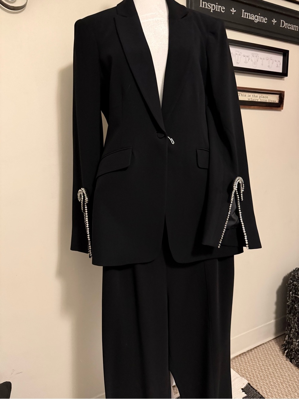 Womans black tuxedo laced with rhinestones